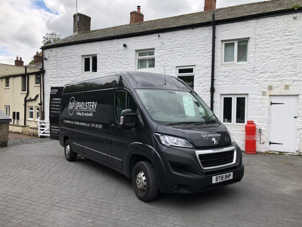 D&P Upholstery van outside the white-painted Berties of Otterburn building.