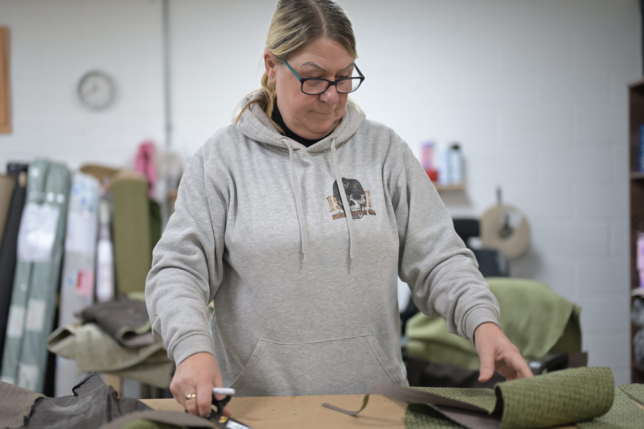 Angela working with upholstery materials
