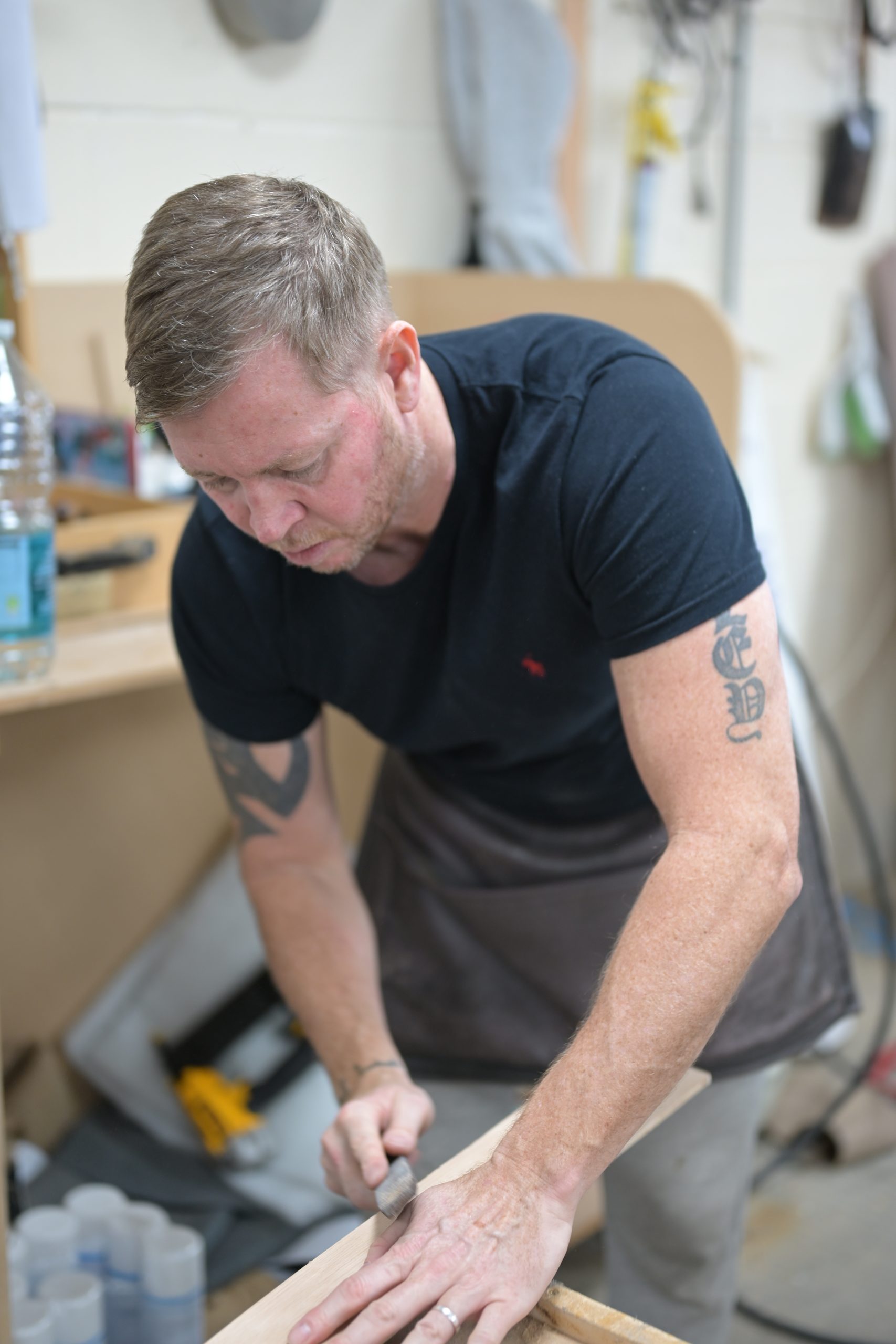 Scott carrying out upholstery work